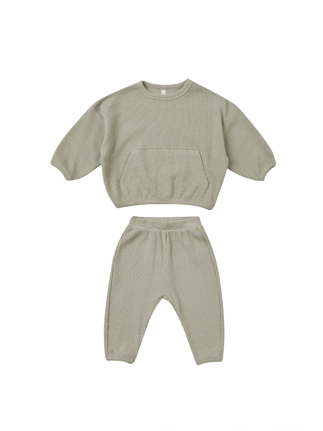 Sage green waffle sweatsuit. The waffle set features a front pocket on the crewneck and the matching pants. 