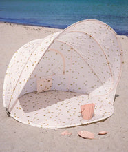 Load image into Gallery viewer, pop up beach tent for kids featuring a beige colour and lemon print. This tent also protects rom UV rays.
